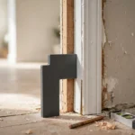 A bright home interior doorway with white door casing partly installed