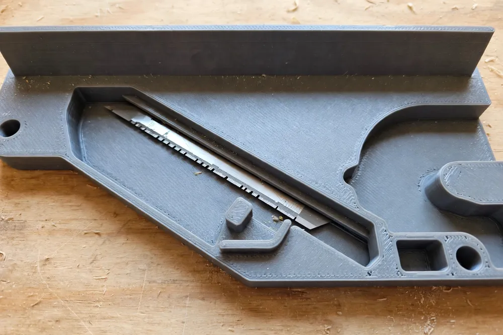 Close-up of the printed trimmer guide from above, showing its wide reference fence