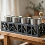 A bright home workshop scene, a matte charcoal-gray 3D printed paint can rack on a wooden shelf holding four quart paint cans upright in individual