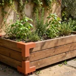 A sunny patio scene, a wooden planter box with matte terracotta-colored 3D printed brackets at its corners, herbs growing inside