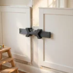 A bright home interior wall with white wainscot panels partly installed